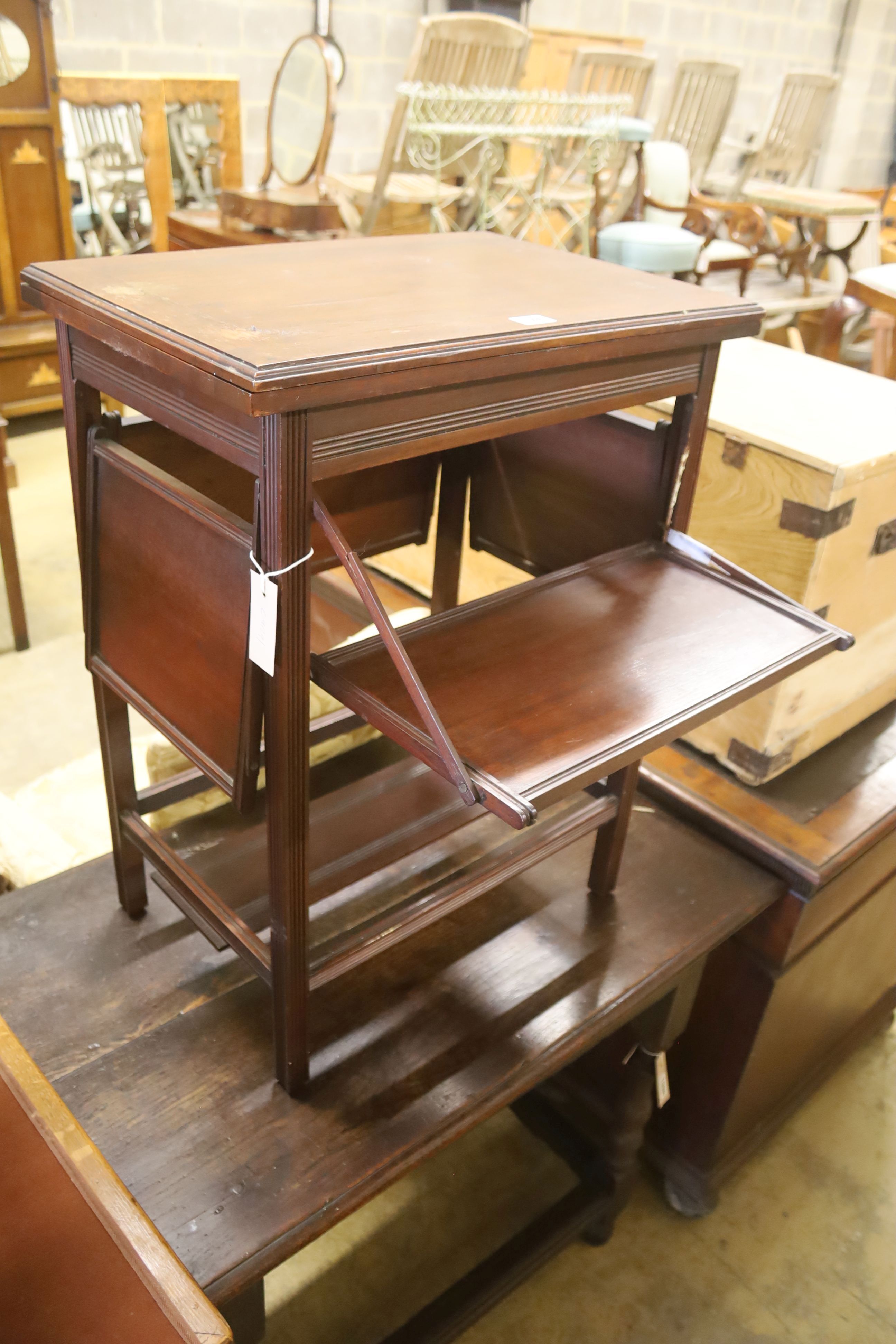 A late Victorian aesthetic movement walnut folding card / occasional table, width 54cm, depth 38cm, height 71cm